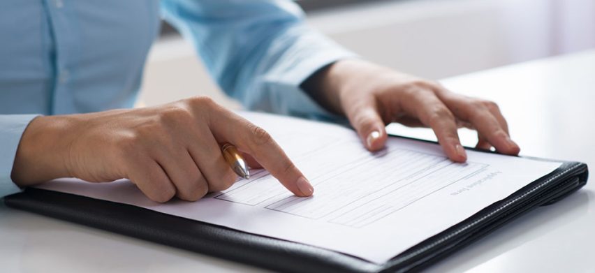 closeup-person-reading-studying-document_1262-16061-852x391